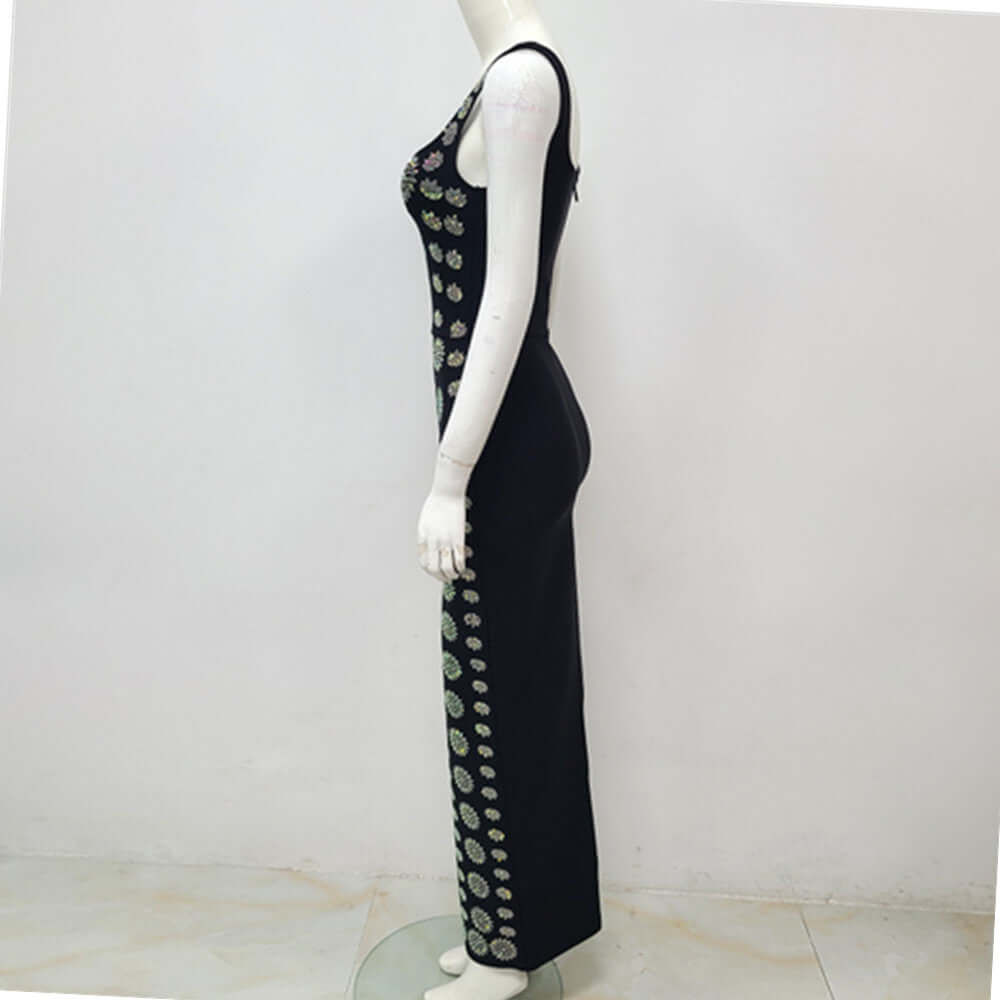 Noir Crystal Gown Noir Crystal Gown showcased on a mannequin from the side view, featuring floral embellishments.
