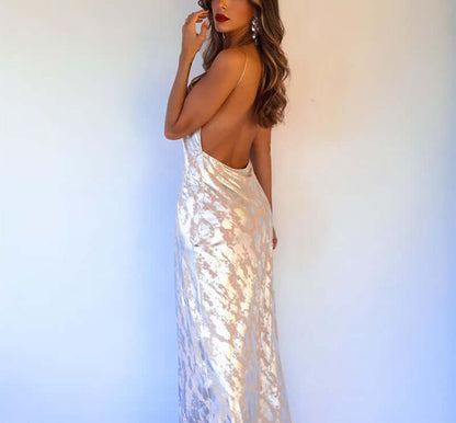Model wearing the Foil Luxe Dress Foil Luxe Dress with a sleeveless design and high-waisted long skirt.