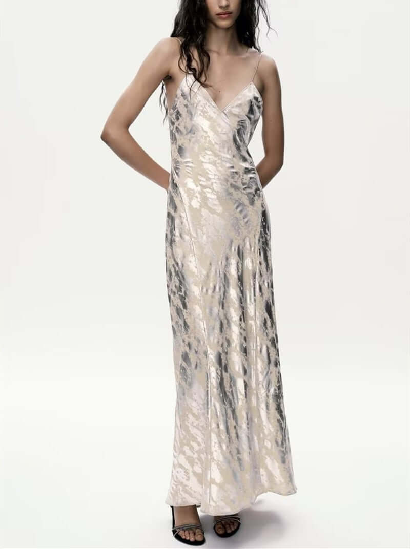 Foil Luxe Dress Foil Luxe Dress worn by a model, featuring a sleeveless design and long high-waisted skirt.