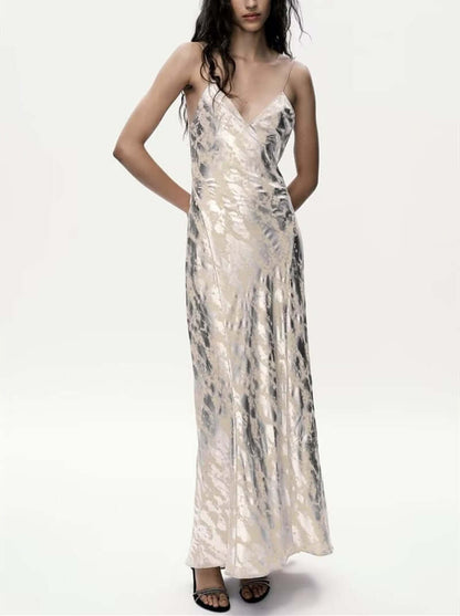 Foil Luxe Dress Foil Luxe Dress worn by a model, featuring a sleeveless design and long high-waisted skirt.