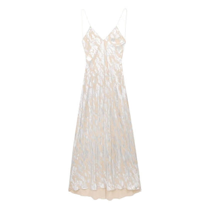 Foil Luxe Dress Foil Luxe Dress in a long, sleeveless, high-waisted design with a unique printing pattern.