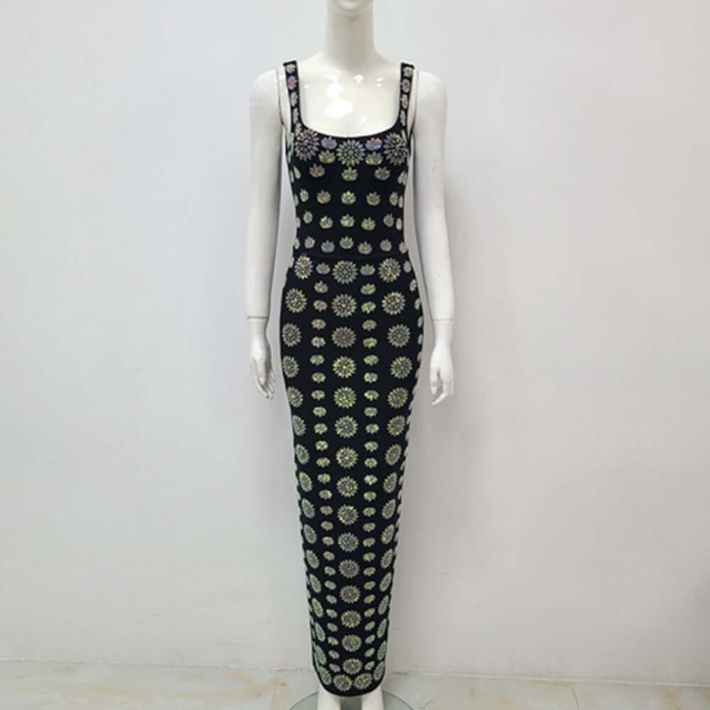 Noir Crystal Gown Noir Crystal Gown displayed on a mannequin with floral pattern design in black and colors.