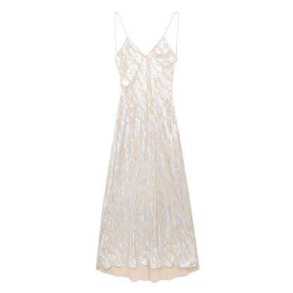 Foil Luxe Dress Foil Luxe Dress featuring a high-waisted, sleeveless design in a long, blended fabric.