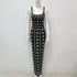 Noir Crystal Gown Noir Crystal Gown displayed on a mannequin, showcasing its elegant design and intricate pattern.